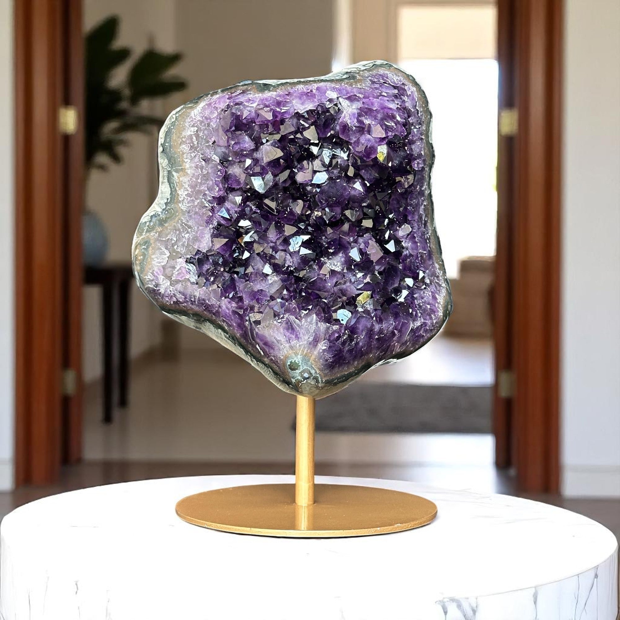 extra large amethyst on golden display