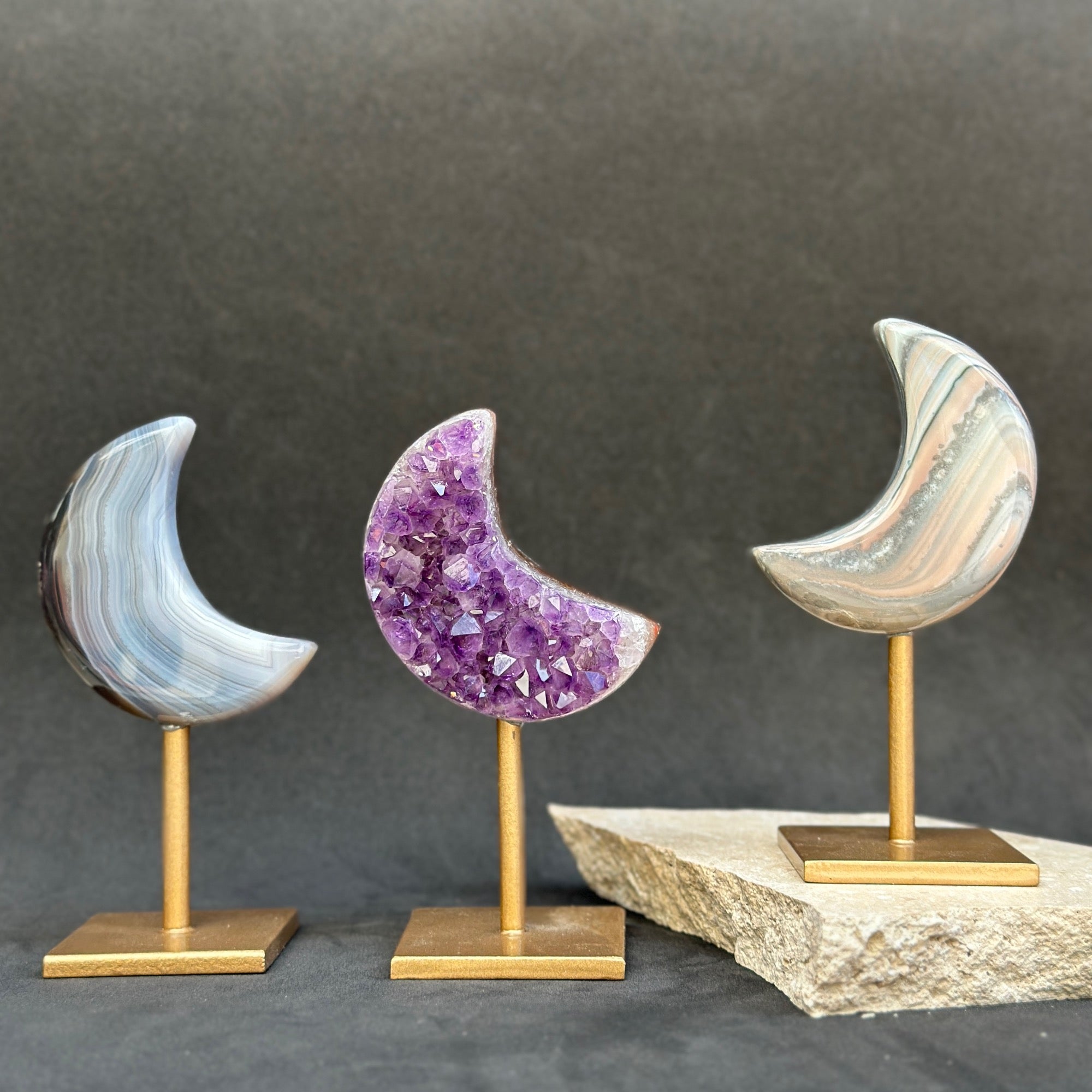 small agate amethyst and jasper crystal on golden display