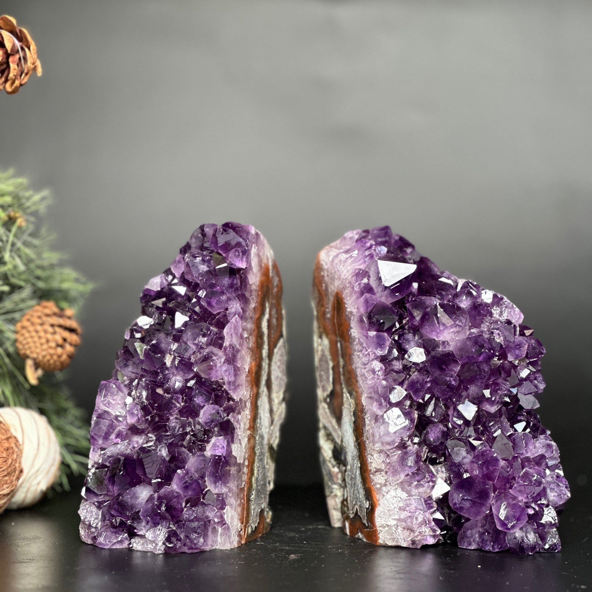 Extra large amethyst geode bookends, a pair of deep purple crystal clusters with natural stone edges.