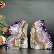 Supersized amethyst geode bookends with deep purple crystals and natural stone banding.