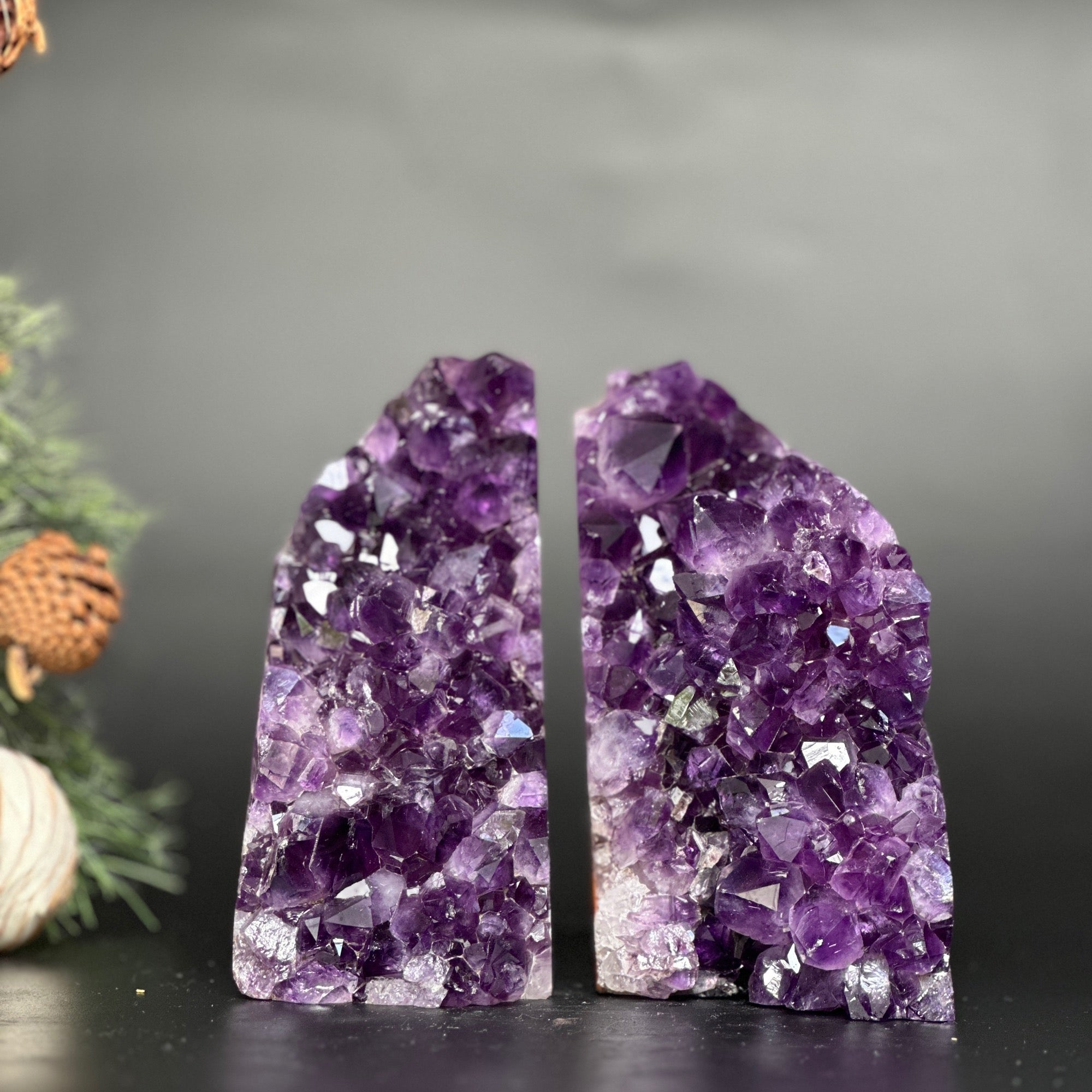 Two supersized, premium quality amethyst geode bookends with deep purple crystals.