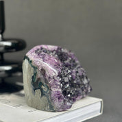 Huge Uruguayan amethyst cave geode with deep purple crystals and agate formations.