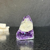 Rare amethyst crystal cathedral, 3.5-inch tall, with deep purple facets and polished edges.