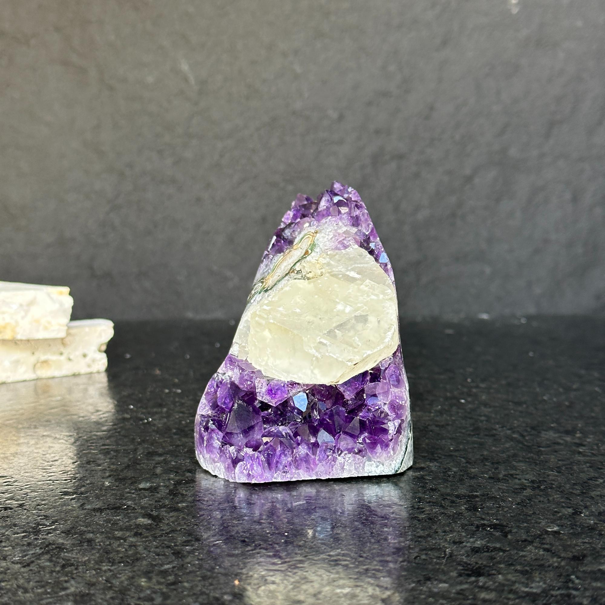 Rare amethyst crystal cathedral, 3.5-inch tall, with deep purple facets and polished edges.