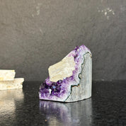Rare amethyst crystal cathedral, 3.5-inch tall, with deep purple druzy and polished edges.
