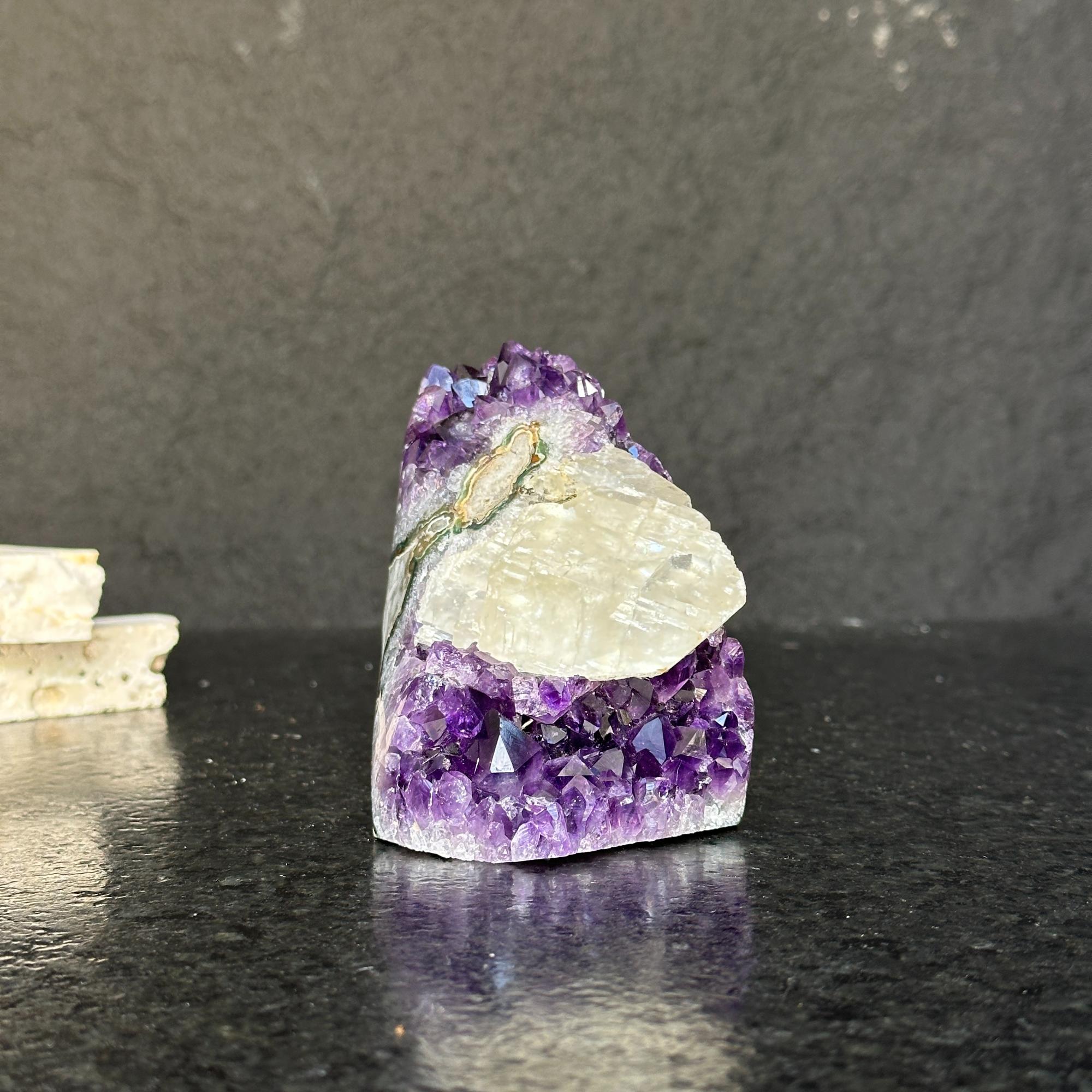 Rare amethyst crystal cathedral with deep purple druzy and polished edges.