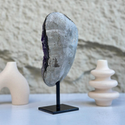 Self-standing 8-inch Uruguayan amethyst geode with sparkly purple crystals on a black stand.