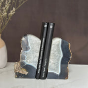 Pair of large, polished amethyst and agate geode bookends with natural gray, white, and purple crystals.