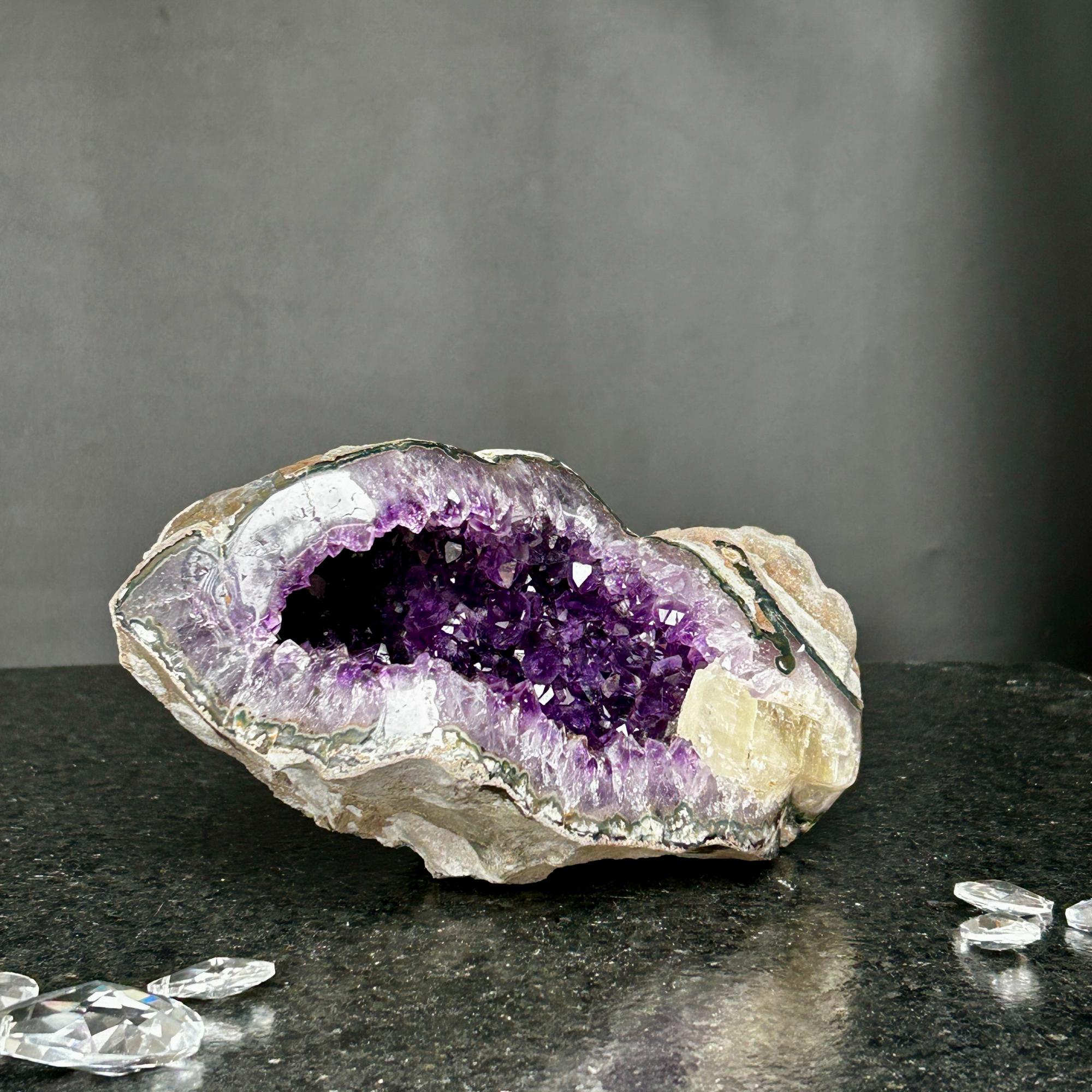 Vibrant deep purple Uruguayan amethyst geode, 9.5x5 inch, 7.2 lb, with sparkling crystals.