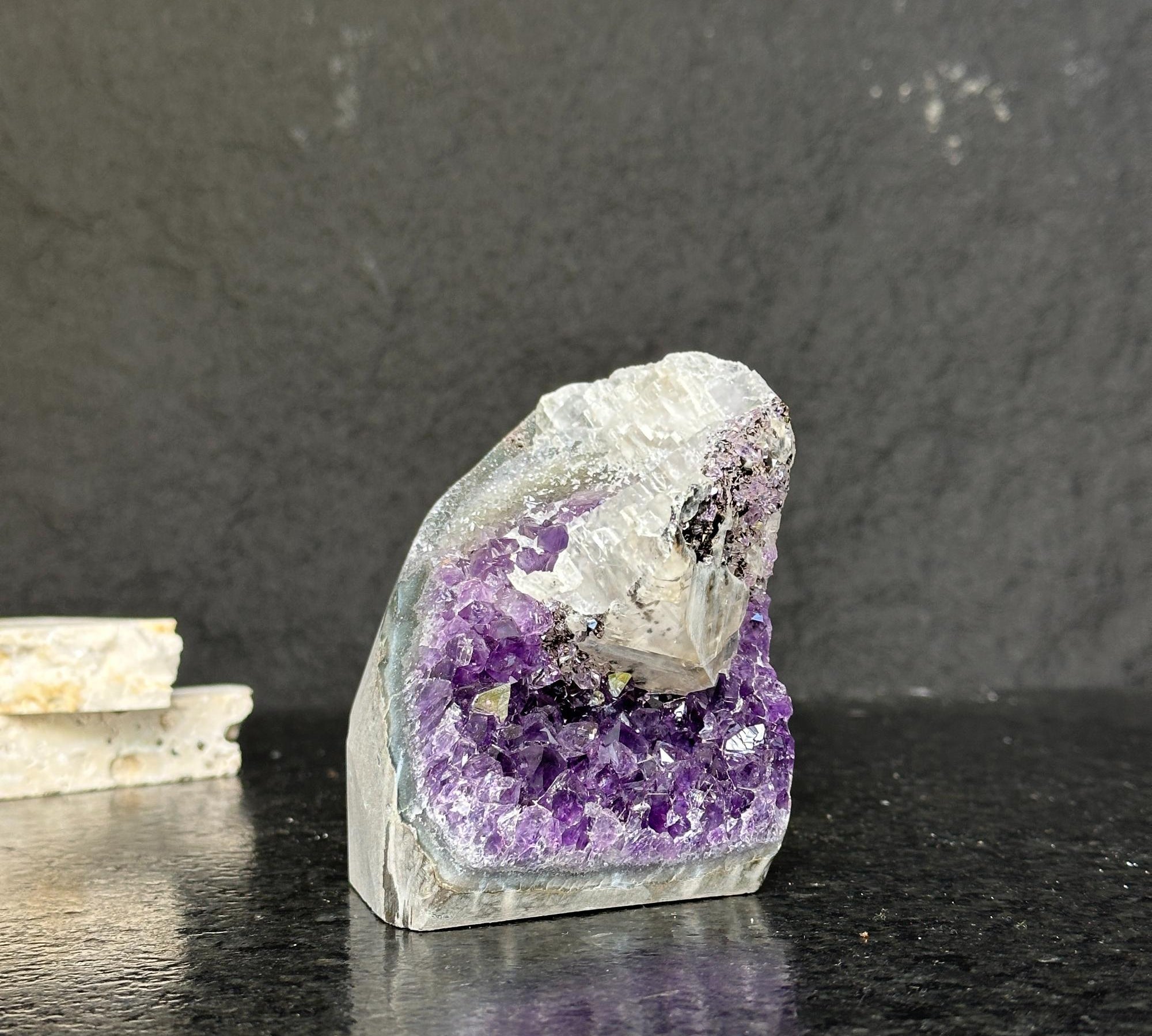 Self-standing amethyst geode cathedral, 3.5" tall, with sparkling deep purple crystals and a raw grey exterior.