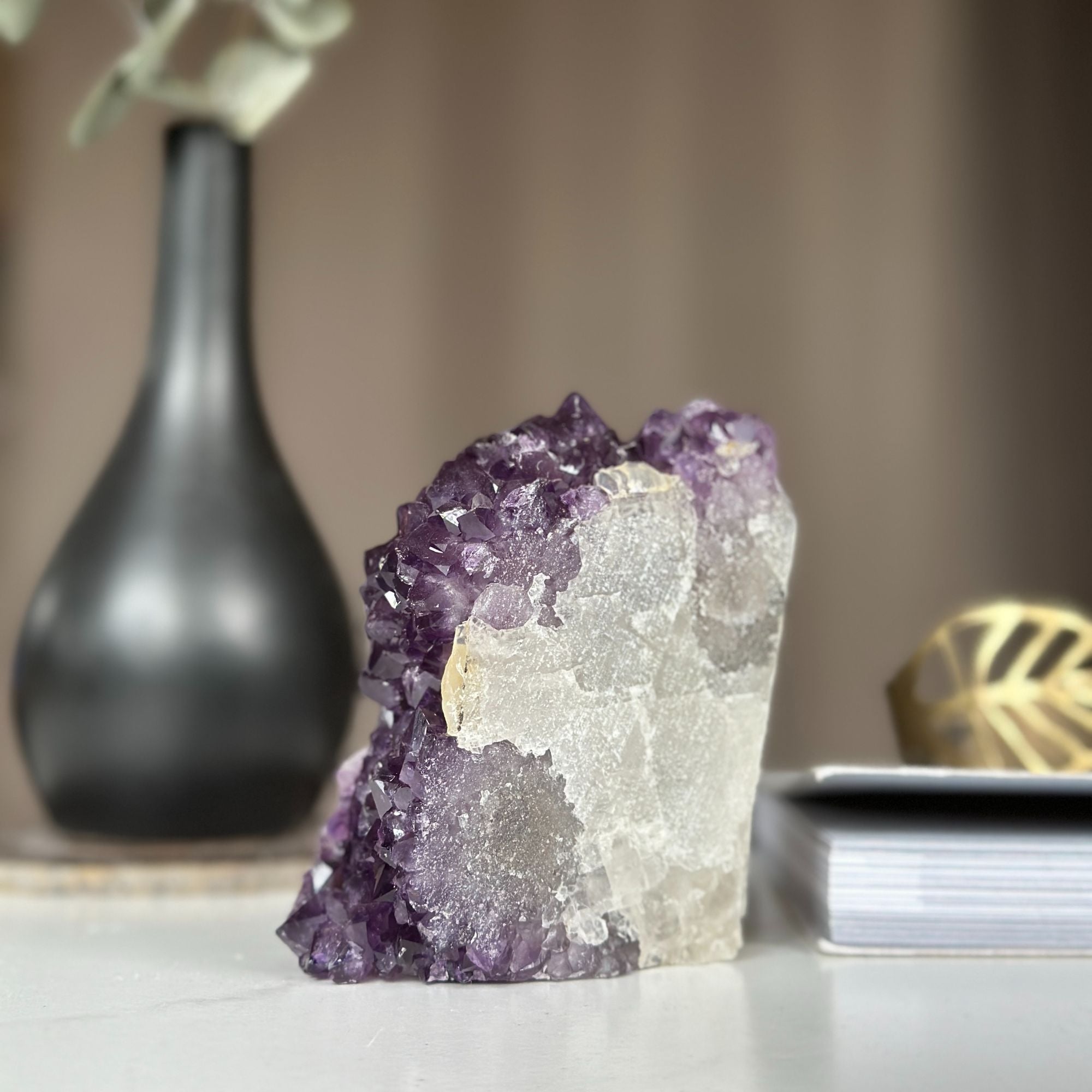Unique self-standing amethyst cathedral geode with deep purple crystal clusters and a natural white base.