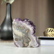 Self-standing Uruguayan amethyst cathedral geode, 4-inch tall purple crystal cluster with unique patterns.