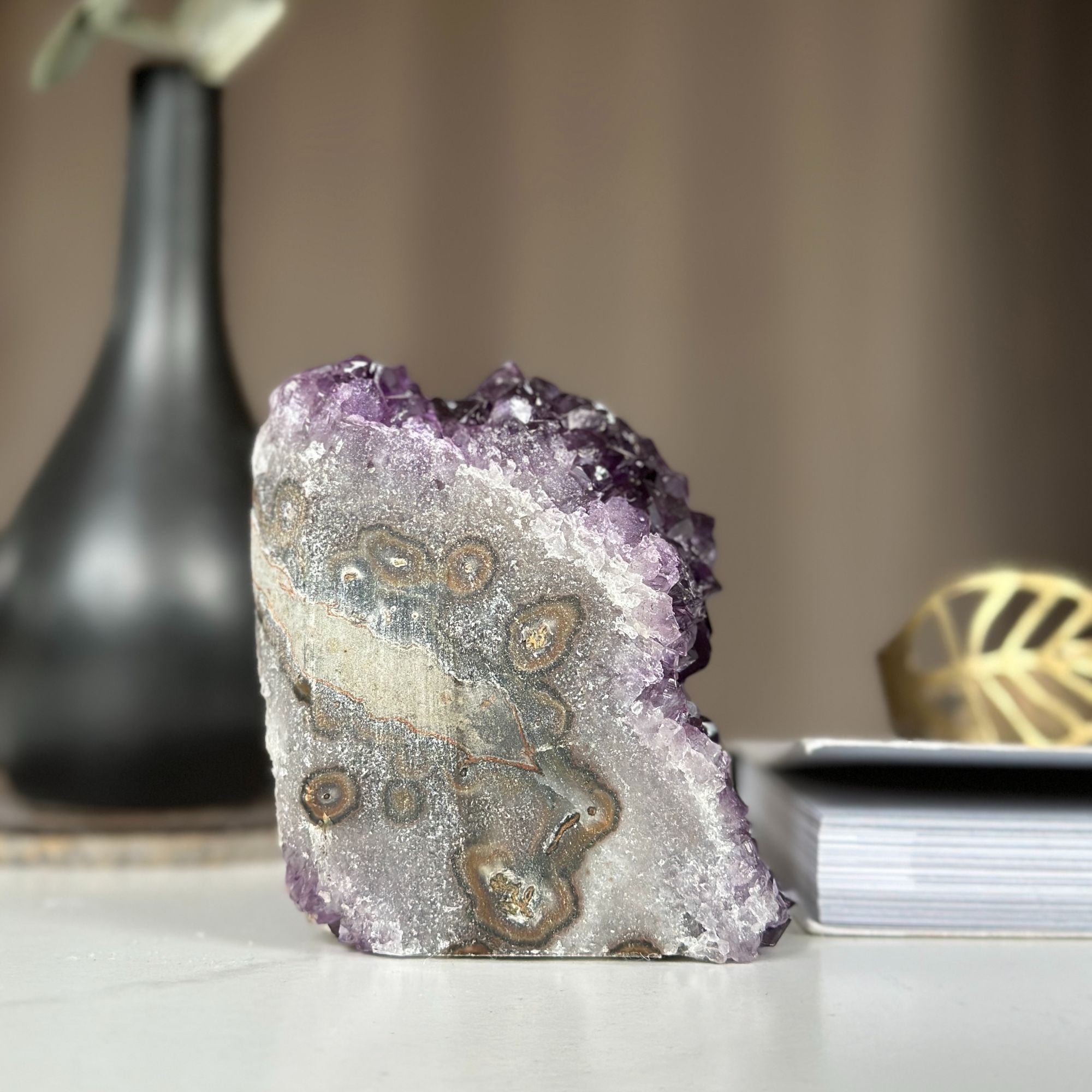 Self-standing Uruguayan amethyst cathedral geode, 4-inch tall purple crystal cluster with unique patterns.