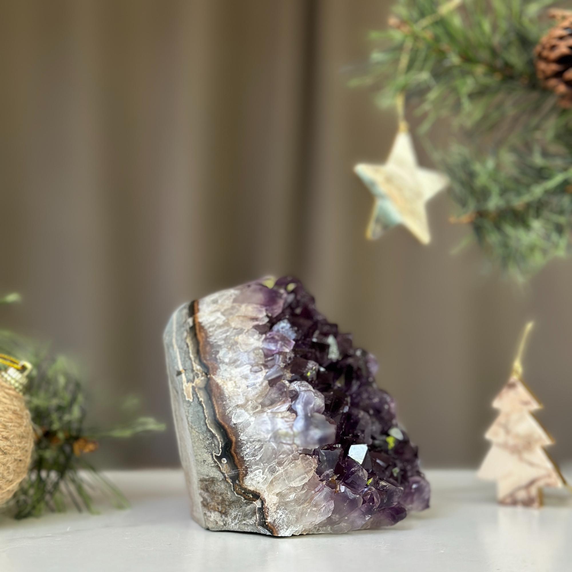 Deep purple Uruguayan amethyst cathedral geode, 3x3 inches, with Christmas decor.