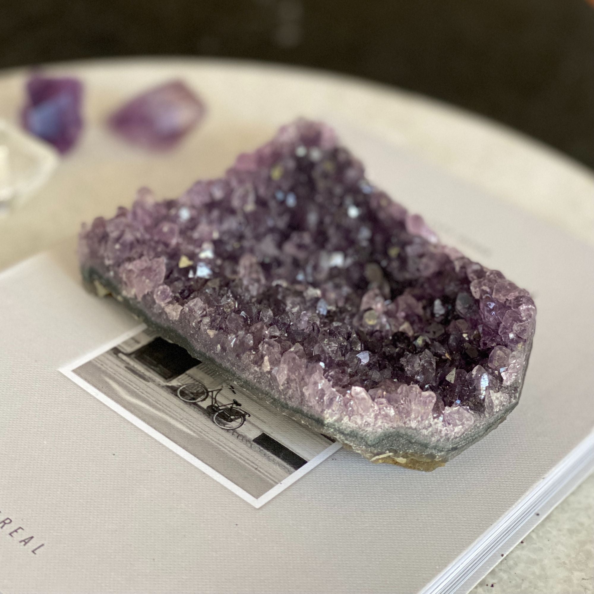 Vibrant deep purple amethyst cluster from Uruguay, 3x4.3 inches, with sparkling crystals.