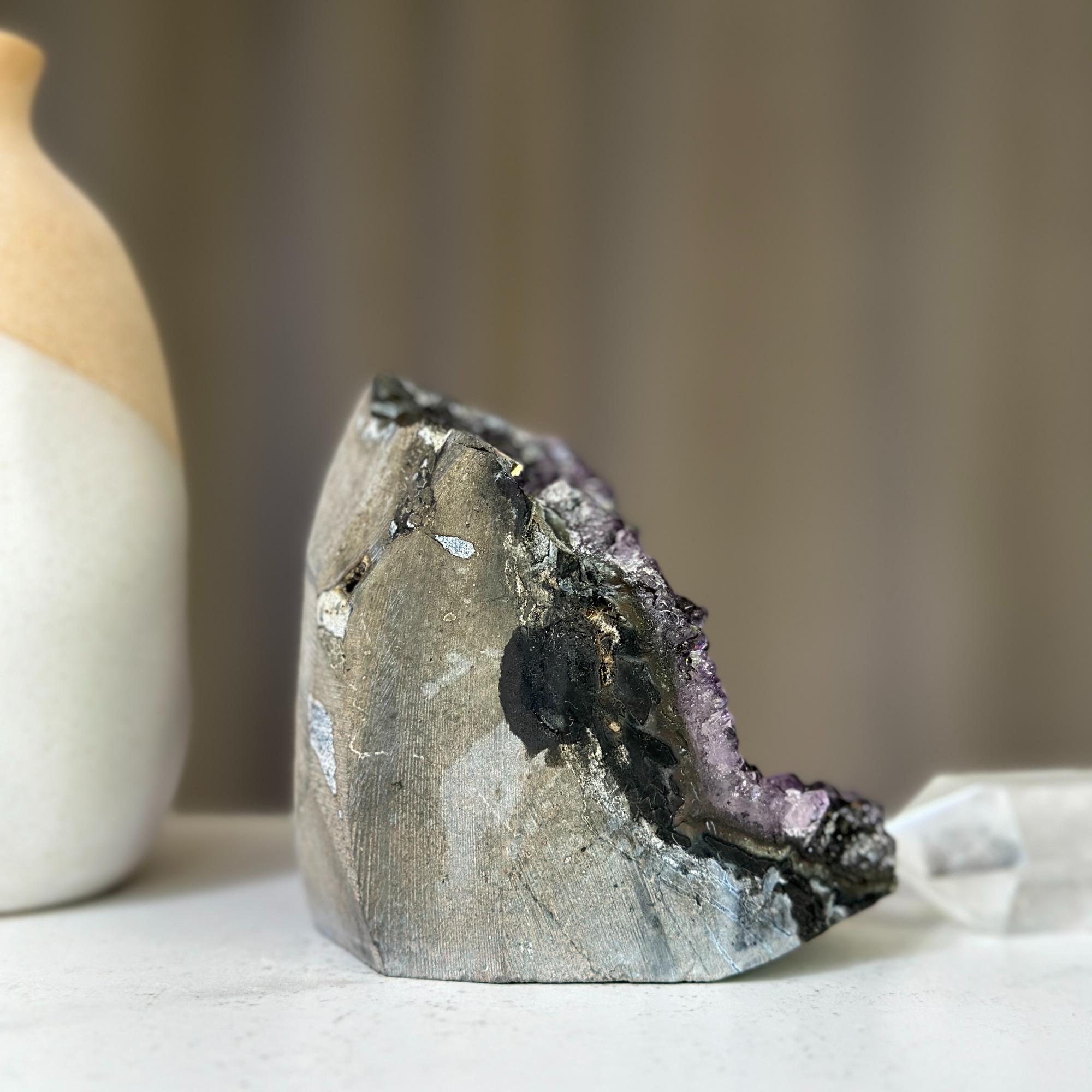 Polished 4-inch tall Uruguayan amethyst cluster geode with sparkling deep purple crystals and gray agate formations.