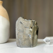 Rough, dark grey amethyst geode exterior with natural rock texture. Measures 2.5x4 inches, 1.5 lbs.