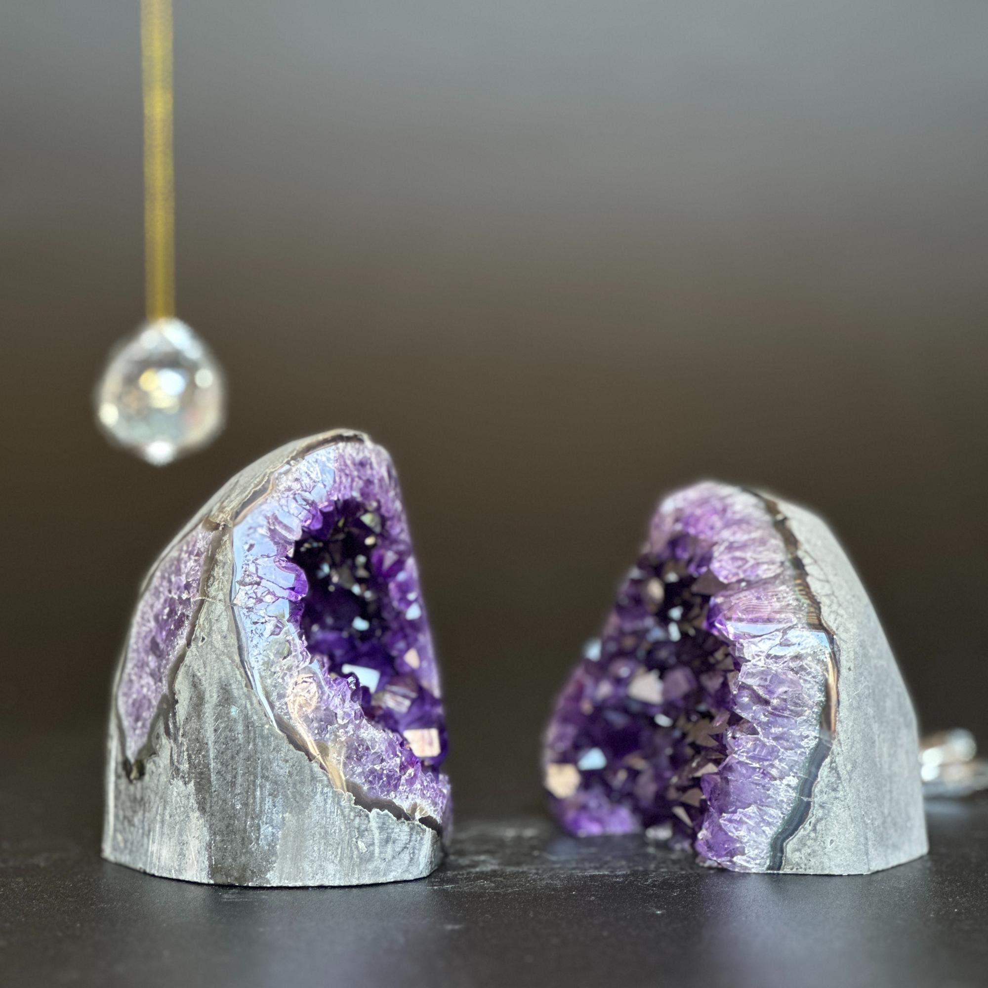 Two deep purple amethyst clusters with shiny agate layers, 3.5-inch tall, on a dark surface.