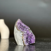Polished amethyst and agate crystal flame geode, 4-inch tall, with vibrant purple crystals and grey-brown edges.