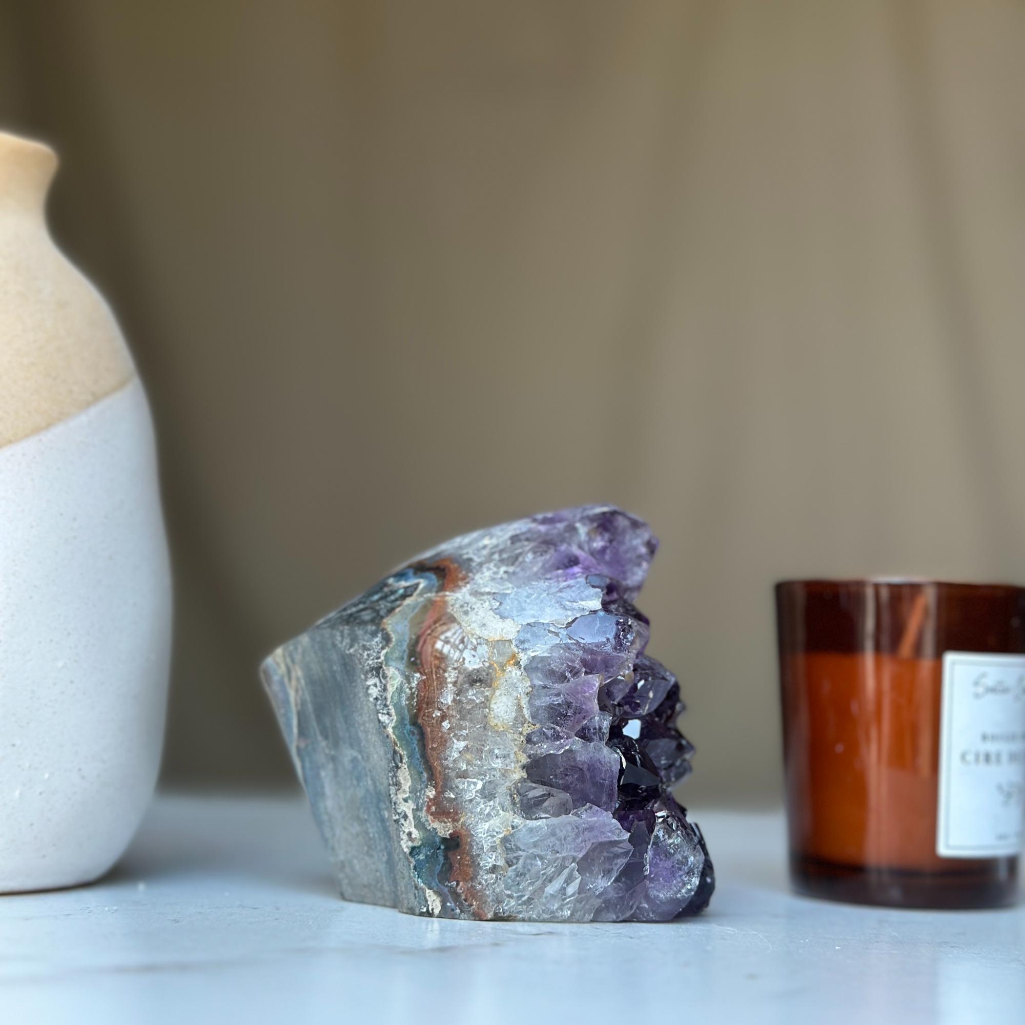 Uruguayan deep purple amethyst geode, large crystal cluster with natural rock casing.