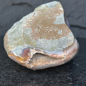 Self-standing Uruguayan amethyst geode, rough earthy exterior, sparkling purple crystal interior.**