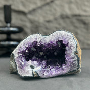 Uruguayan amethyst geode, 6x3.5 inches, with deep purple crystals and natural rock exterior.
