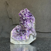 Extra large Uruguayan amethyst geode cathedral with deep purple crystals and agate formations.