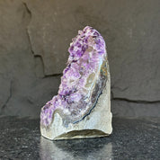 Extra large amethyst geode cathedral with deep purple crystals and agate formations.