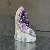 Extra large Uruguayan amethyst geode cathedral with deep purple crystals and agate formations.