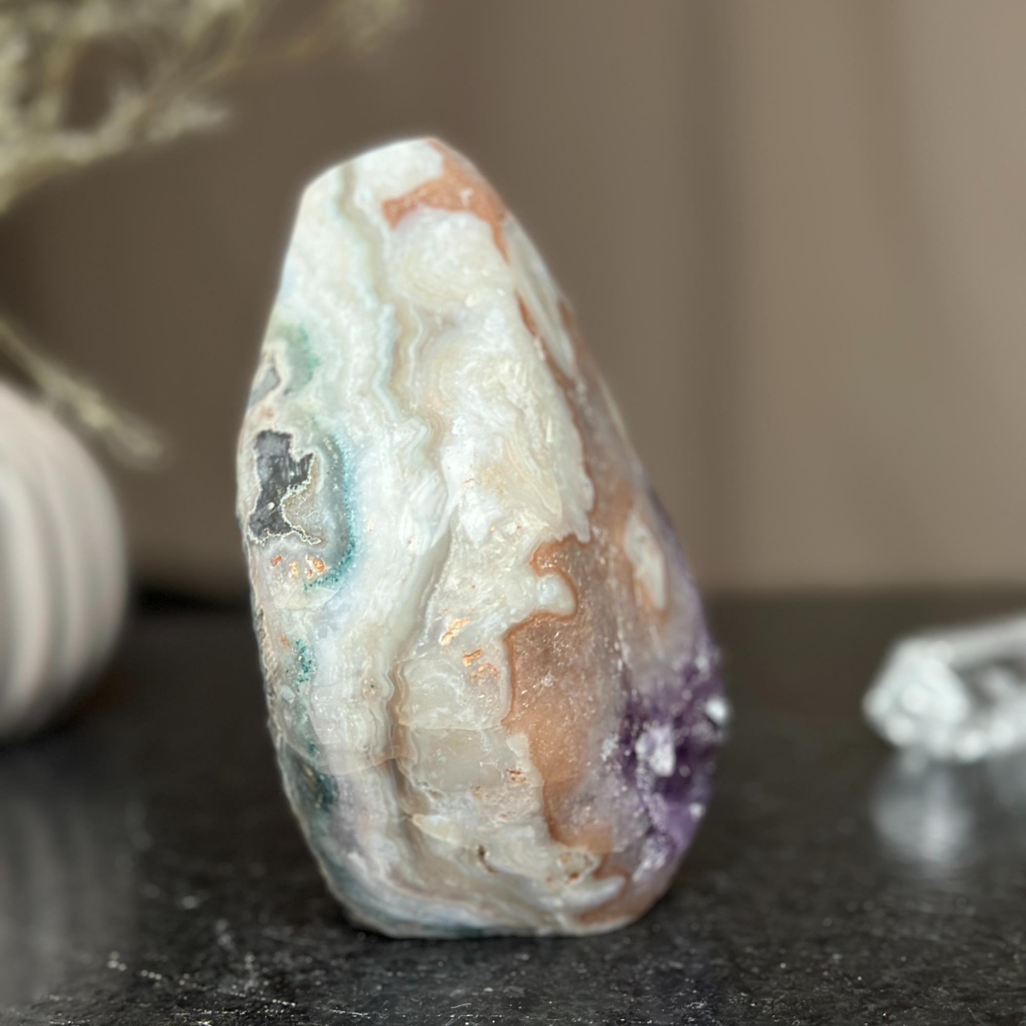 Polished 6-inch natural agate and amethyst flame cluster with white, brown, green, and purple hues.