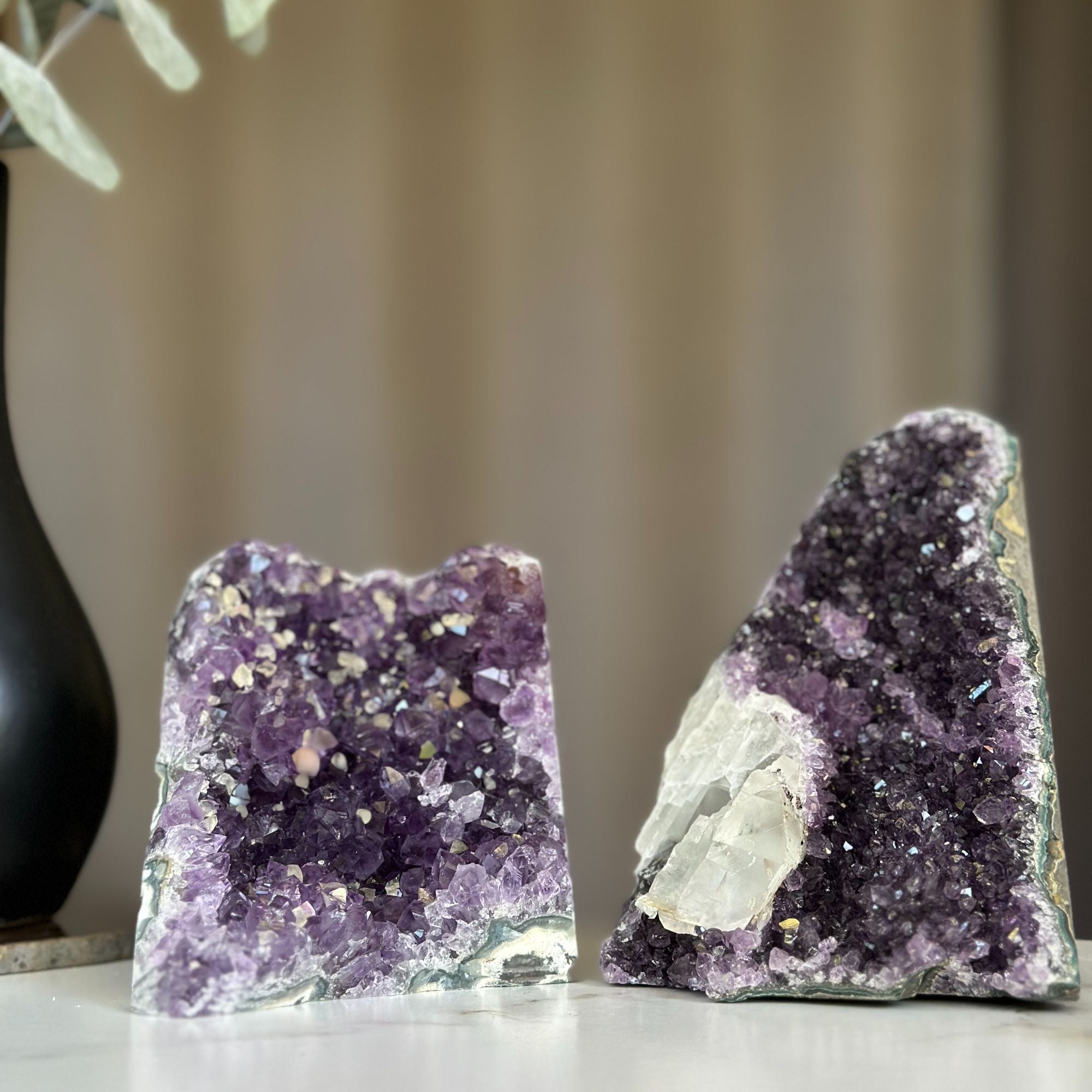 Two deep purple amethyst geodes with calcite formations, 5x3.5 inches, 3.9 lb set.