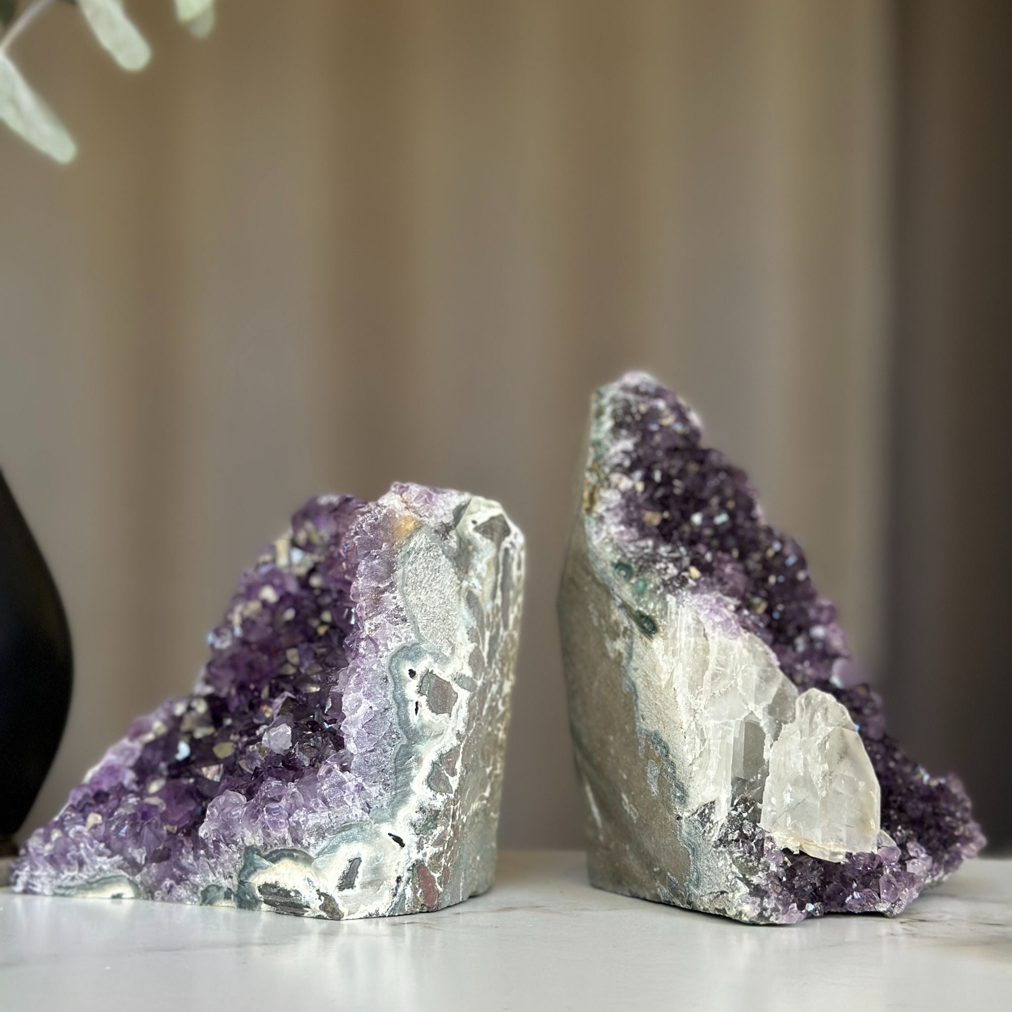 Two deep purple amethyst geodes with calcite formations, 5x3.5 inches, 3.9 lb set.