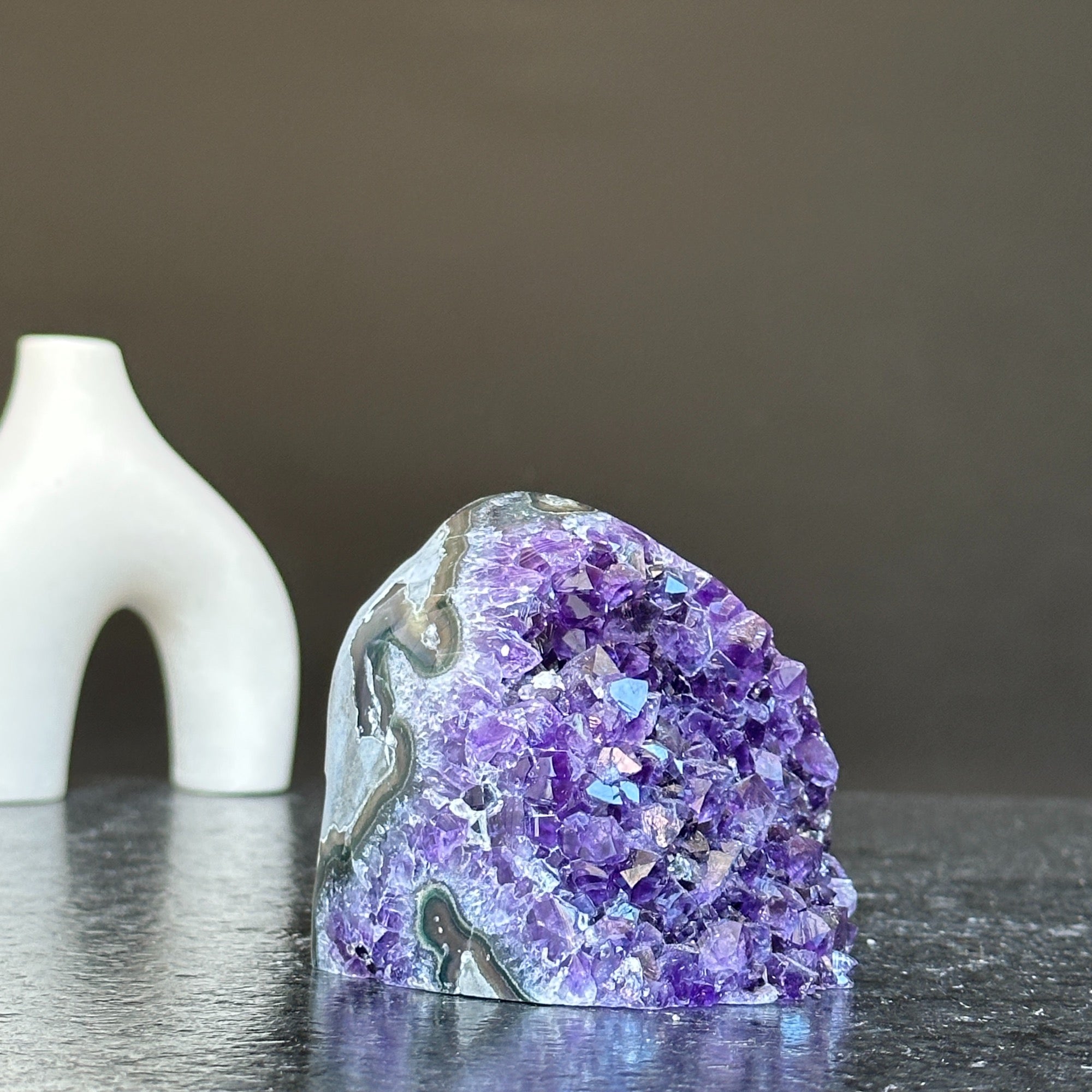 Self-standing cut base amethyst crystal cluster, 3x3 inch, with deep purple facets and natural gray banding.