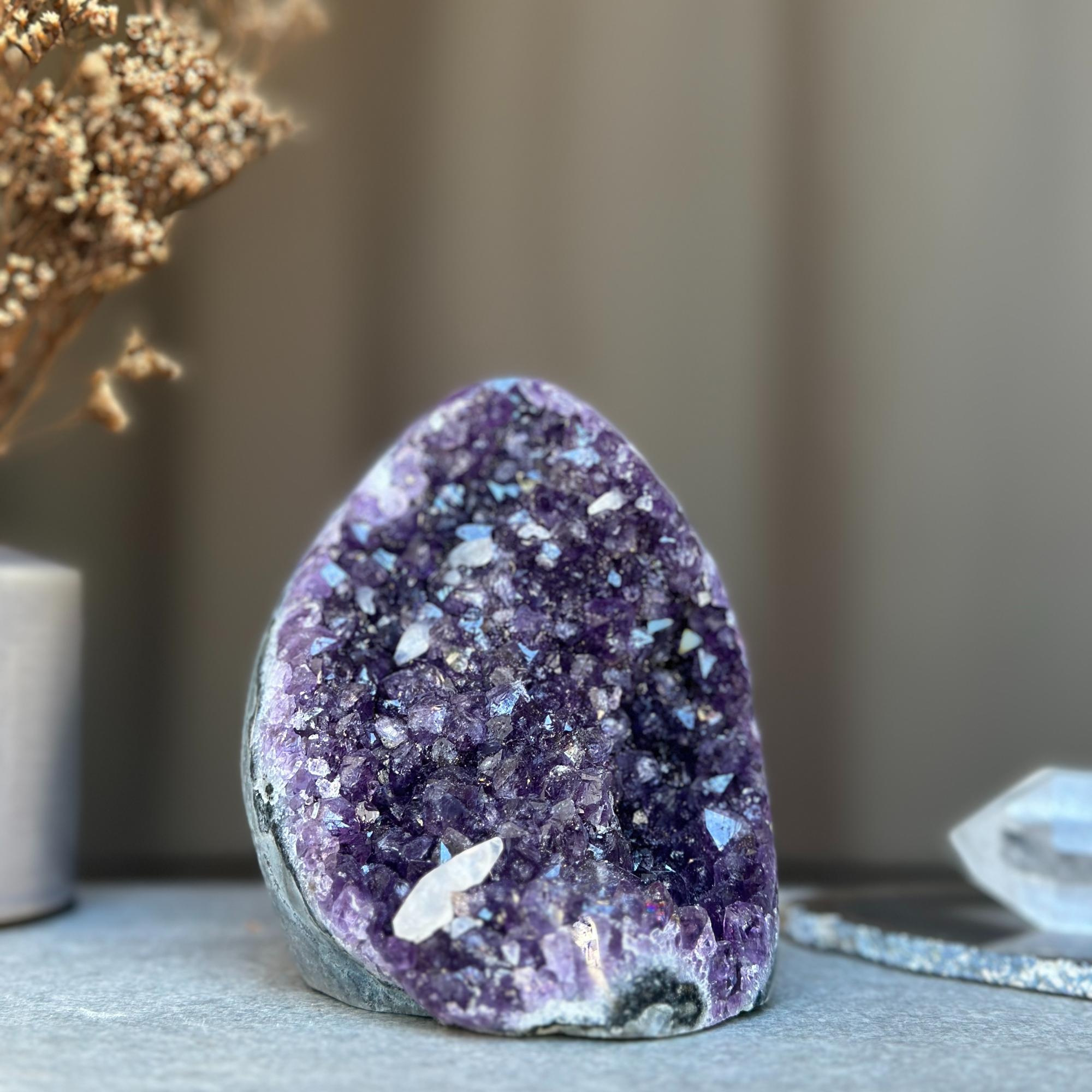 High-quality deep purple amethyst geode cluster from Uruguay with sparkling natural crystals.