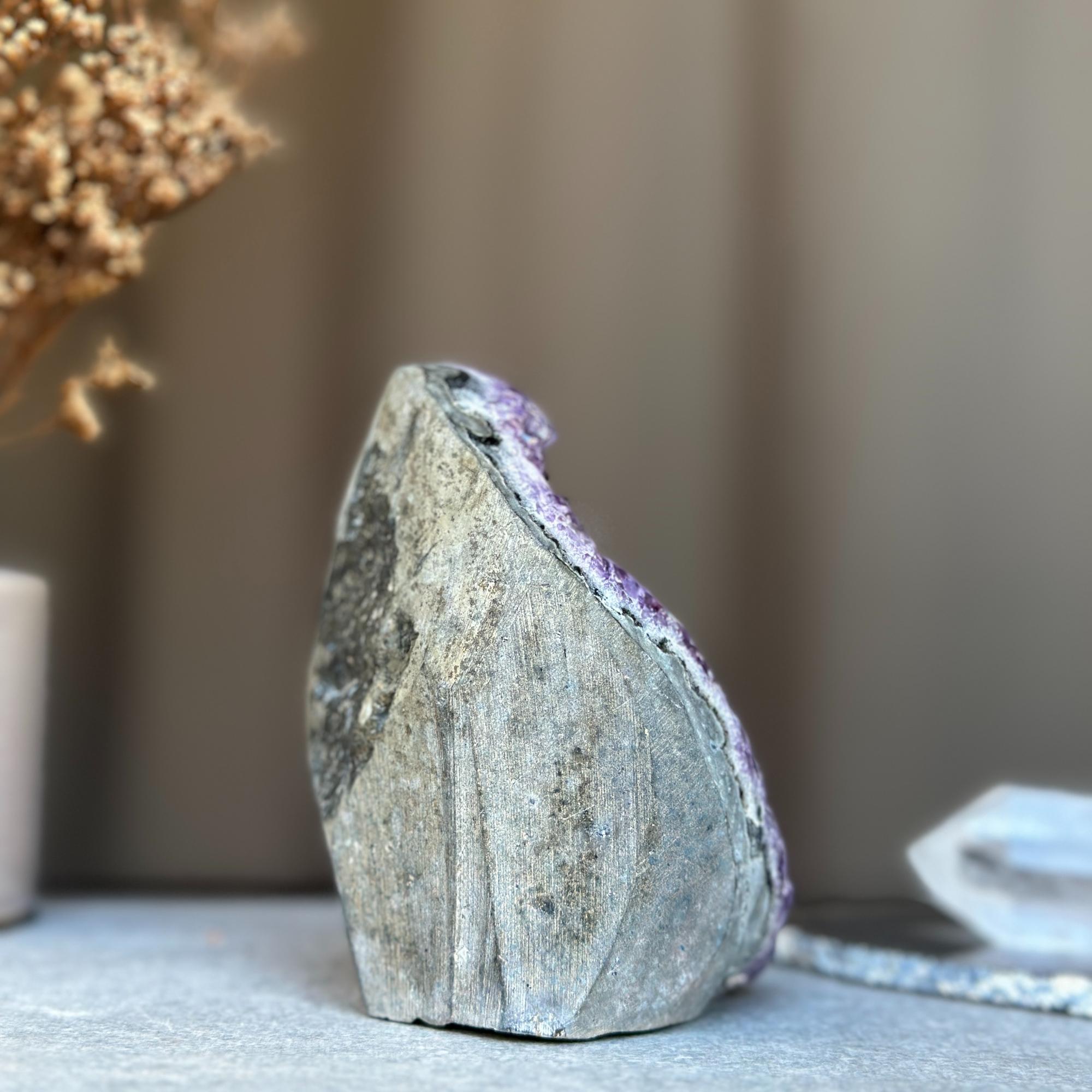 4-inch deep purple amethyst geode cluster with sparkling crystals and a natural rough grey stone exterior.