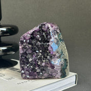 Deep purple amethyst cathedral geode with green agate, self-standing raw crystal cluster.