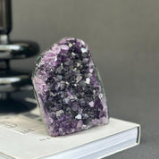 Deep purple amethyst cathedral geode, self-standing raw crystal cluster.