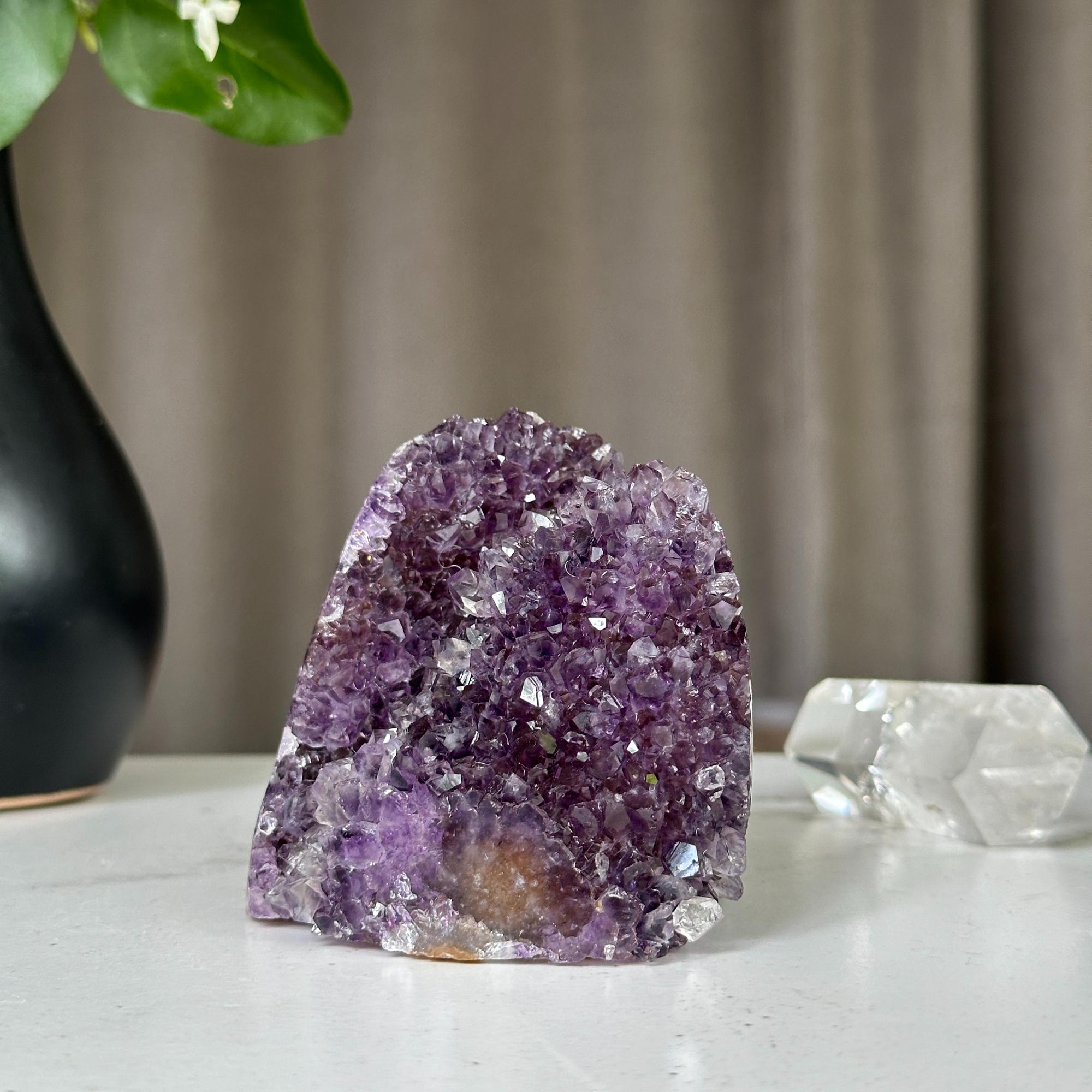 Deep purple Uruguayan amethyst crystal cluster, 3x3 inch, on a white surface.