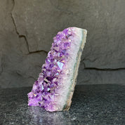 Deep purple amethyst cathedral geode with sparkling crystals and a white-banded edge, 6 inches tall.