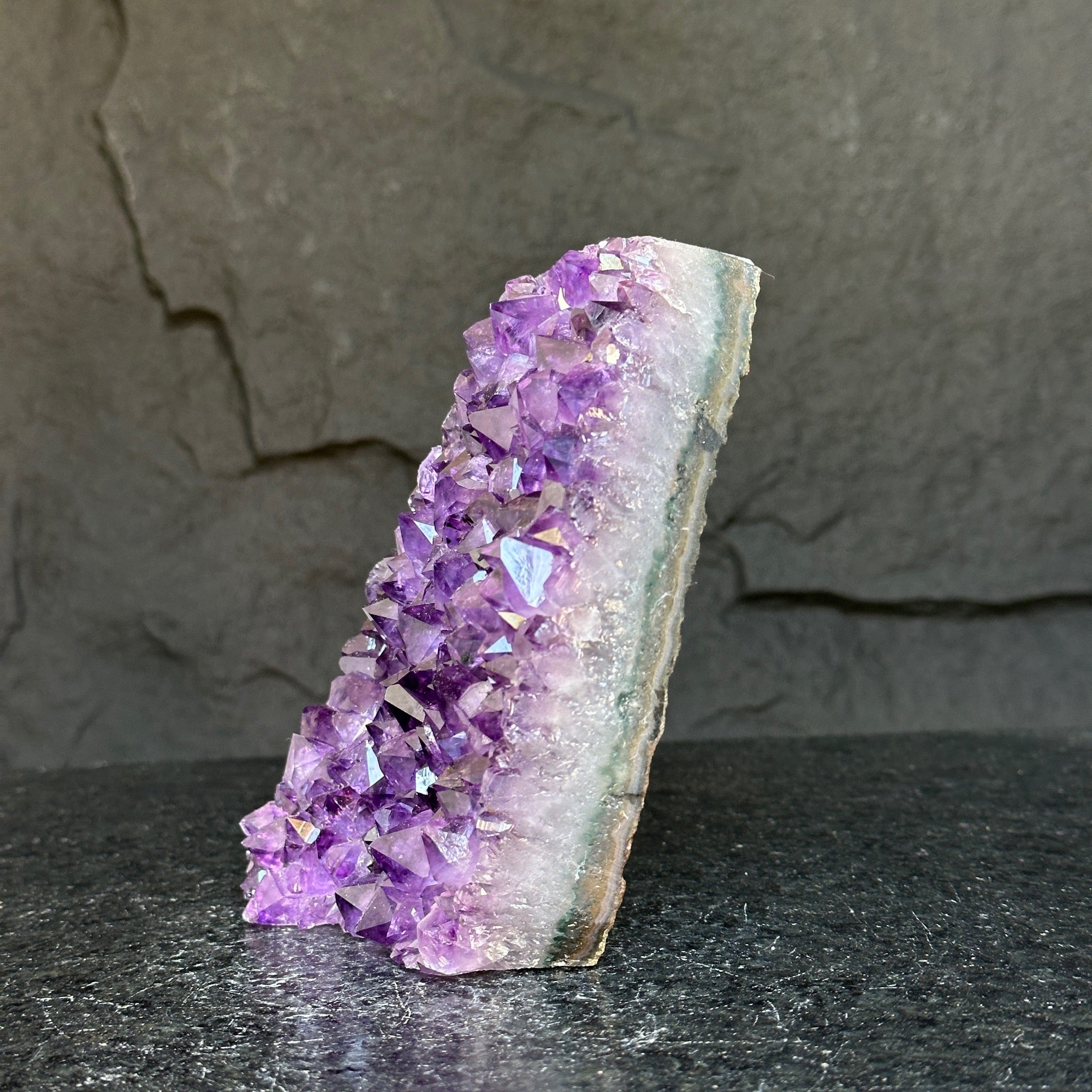 Deep purple amethyst cathedral geode with sparkling crystals and a white-banded edge, 6 inches tall.