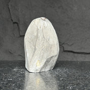 Extra large, rough light grey amethyst cluster with natural striations and unpolished surface.