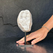 White quartz on stand, Geode with metallic base included for home decoration