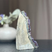 Huge deep purple amethyst crystal cluster with a cut base, 6.5 inches tall.