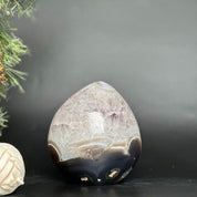Polished deep purple amethyst egg crystal with brown agate formations, 5.5-inch tall.