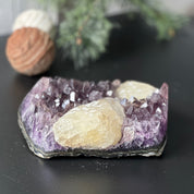 Large, deep-purple amethyst cluster with impressive crystal points and unique yellow calcite formations.