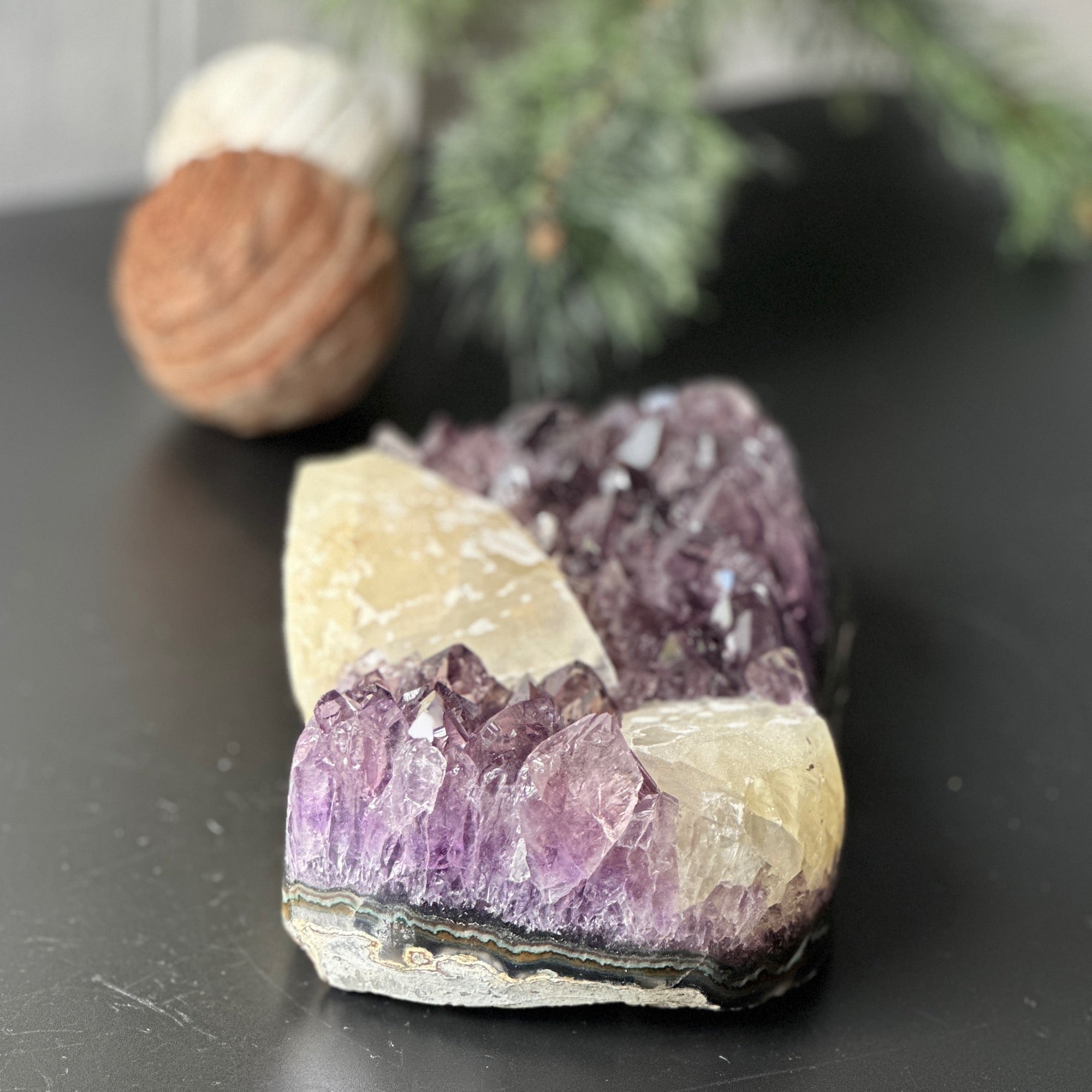 Large, deep-purple amethyst cluster with impressive crystal points and unique calcite formations.