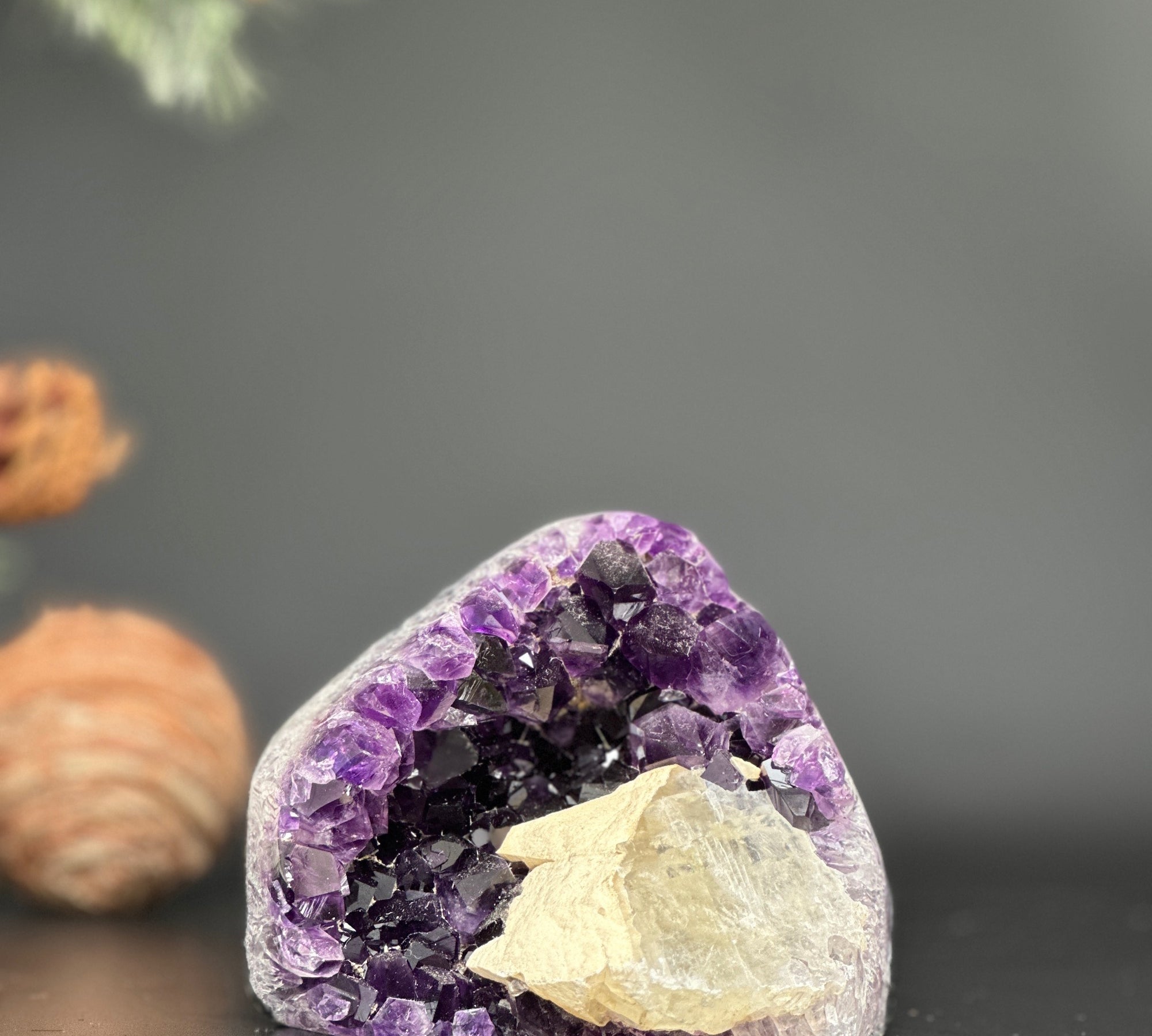 High-quality 3.5-inch Uruguayan amethyst geode cluster with sparkling deep purple crystals and natural rock.