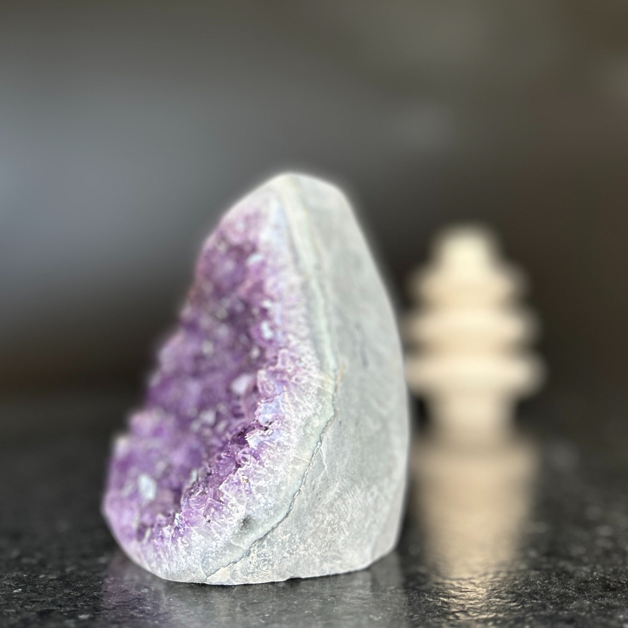 Large natural amethyst crystal geode, 5-inch tall, with vibrant purple clusters and polished gray edges.
