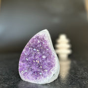 Large, polished amethyst crystal geode with vibrant purple druzy, 5-inch tall flame shape.