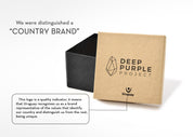 Open kraft gift box with black lid, Deep Purple Project logo, and Uruguay 'COUNTRY BRAND' text.